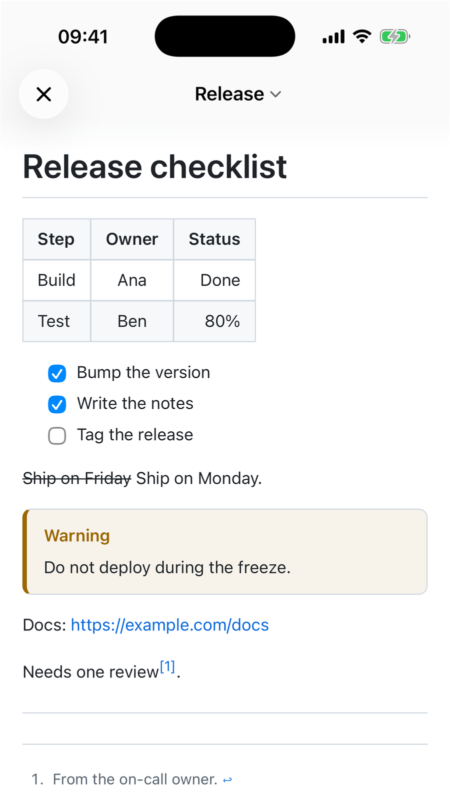 QuickMark on iPhone rendering a Release checklist: an aligned three-column table, two ticked and one empty task box, struck-through Ship on Friday, a Warning alert, an auto-linked https URL and a footnote